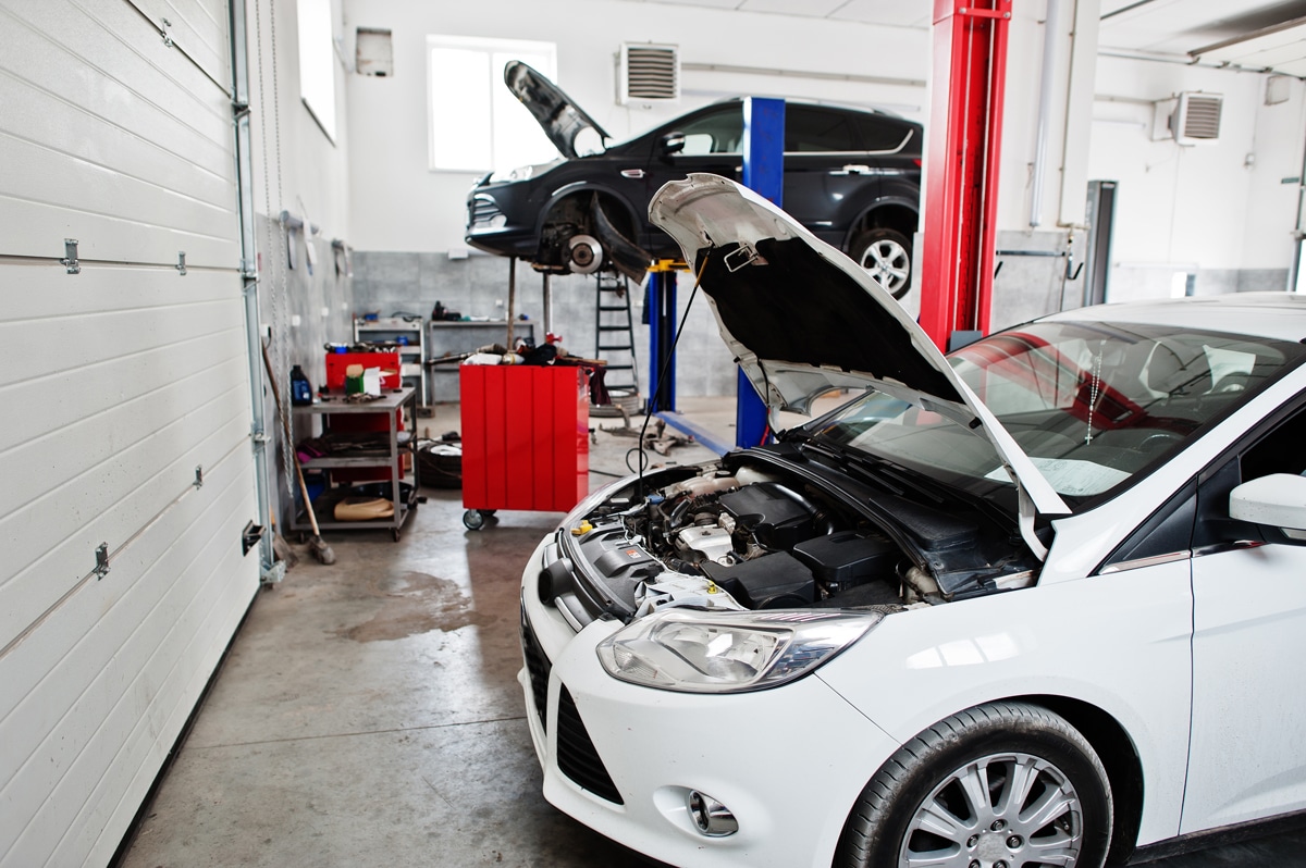 Сar in maintenance at garage service station.
